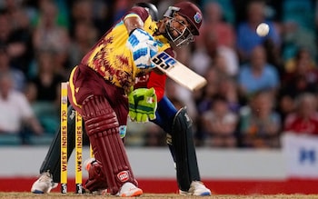 Nicholas Pooran hits a six from a delivery of England's Adil RashidÂ during the first T20 cricket match at Kensington Oval in Bridgetown, Barbados, Tuesday, Dec. 12,