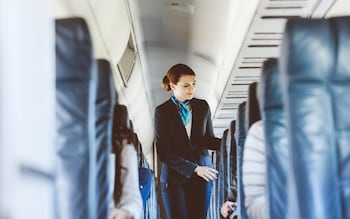 air stewardess inside an airplane