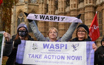 Protesters hold a WASPI (Women Against State Pension Inequality banner) during the demonstration opposite the Old Palace Yard