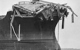 Debris from the Sunshine Skyway Bridge perched on the bow of the freighter 'Summit Venture' after the vessel rammed the bridge during a thunderstorm at Tampa Bay, Florida, causing 34 deaths